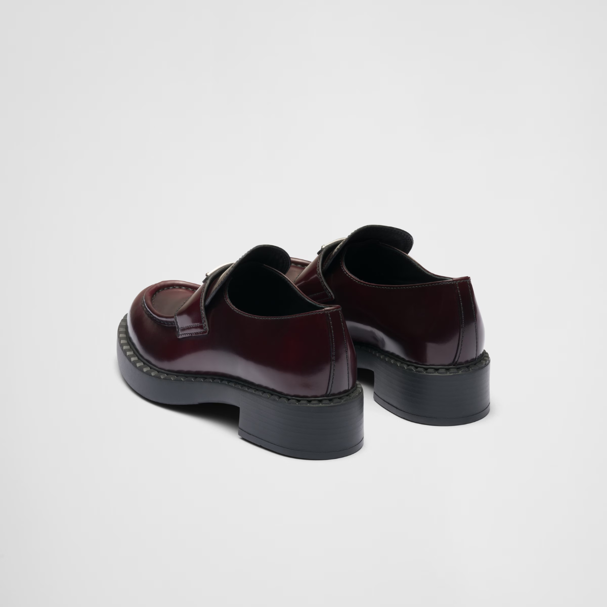 Chocolate brushed leather loafers – upper with leather strap Enameled metal triangle logo 50 mm rubber monobloc sole – LUX VERSE Luxury Designer Fashion Outlet