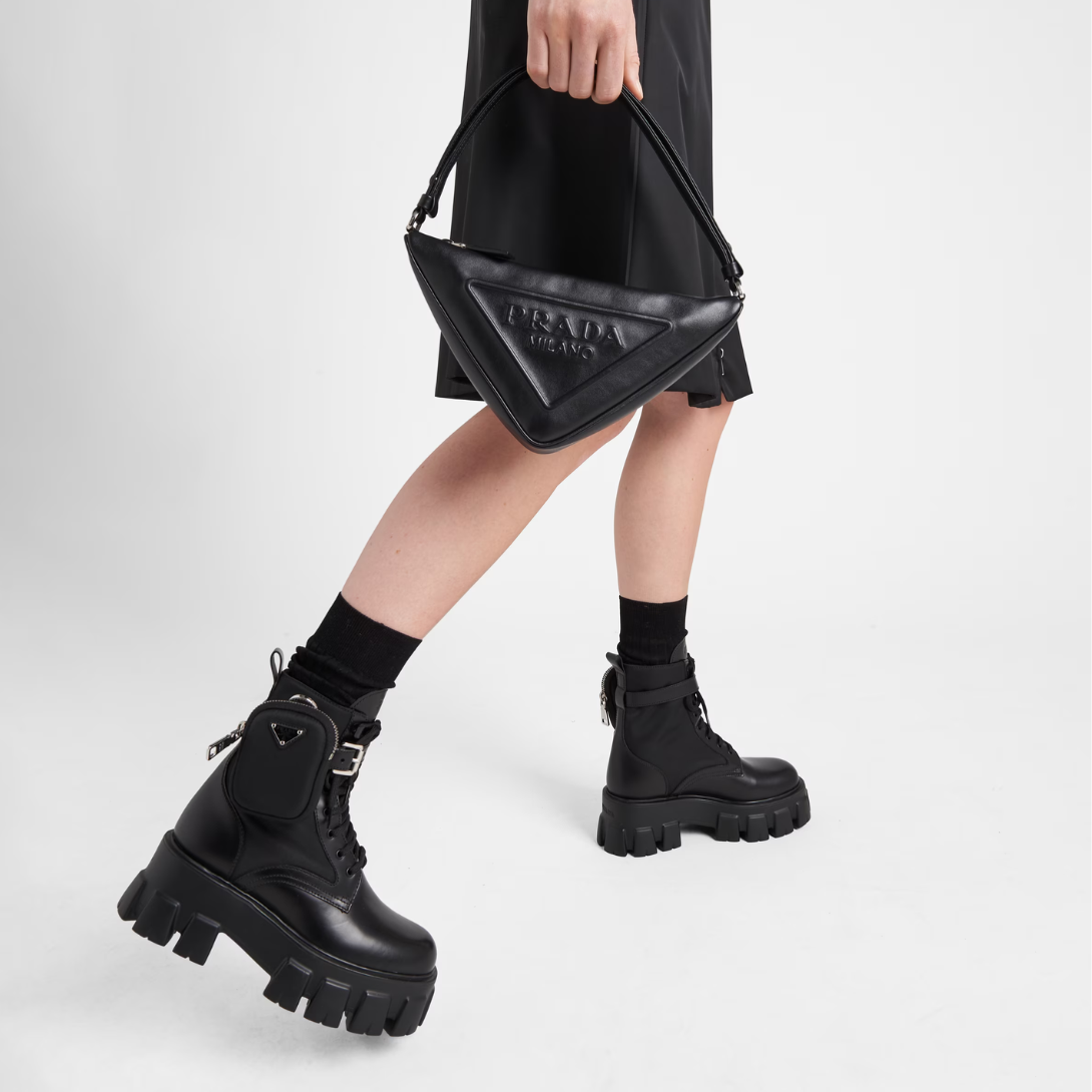 Monolith leather and Re-Nylon boots with pouch – made of leather and nylon, an industrial fabric traditionally tied to the brand, – LUX VERSE Luxury Designer Fashion Outlet