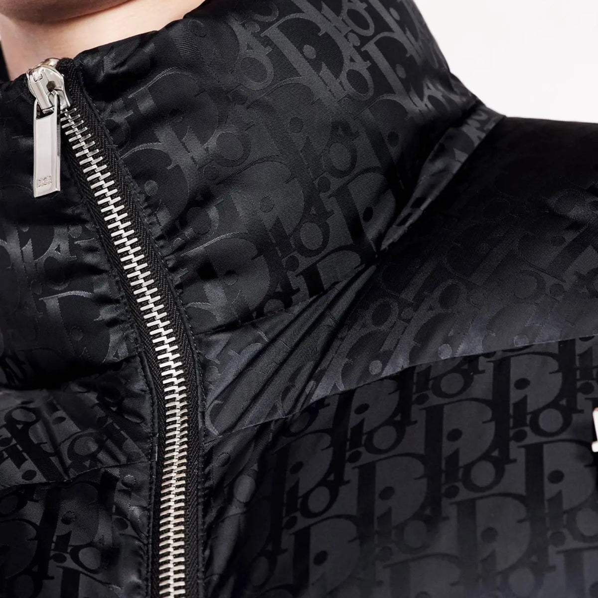 Oblique Down Jacket – the black technical jacquard down jacket pays tribute to House heritage with a tonal – LUX VERSE Luxury Designer Fashion Outlet