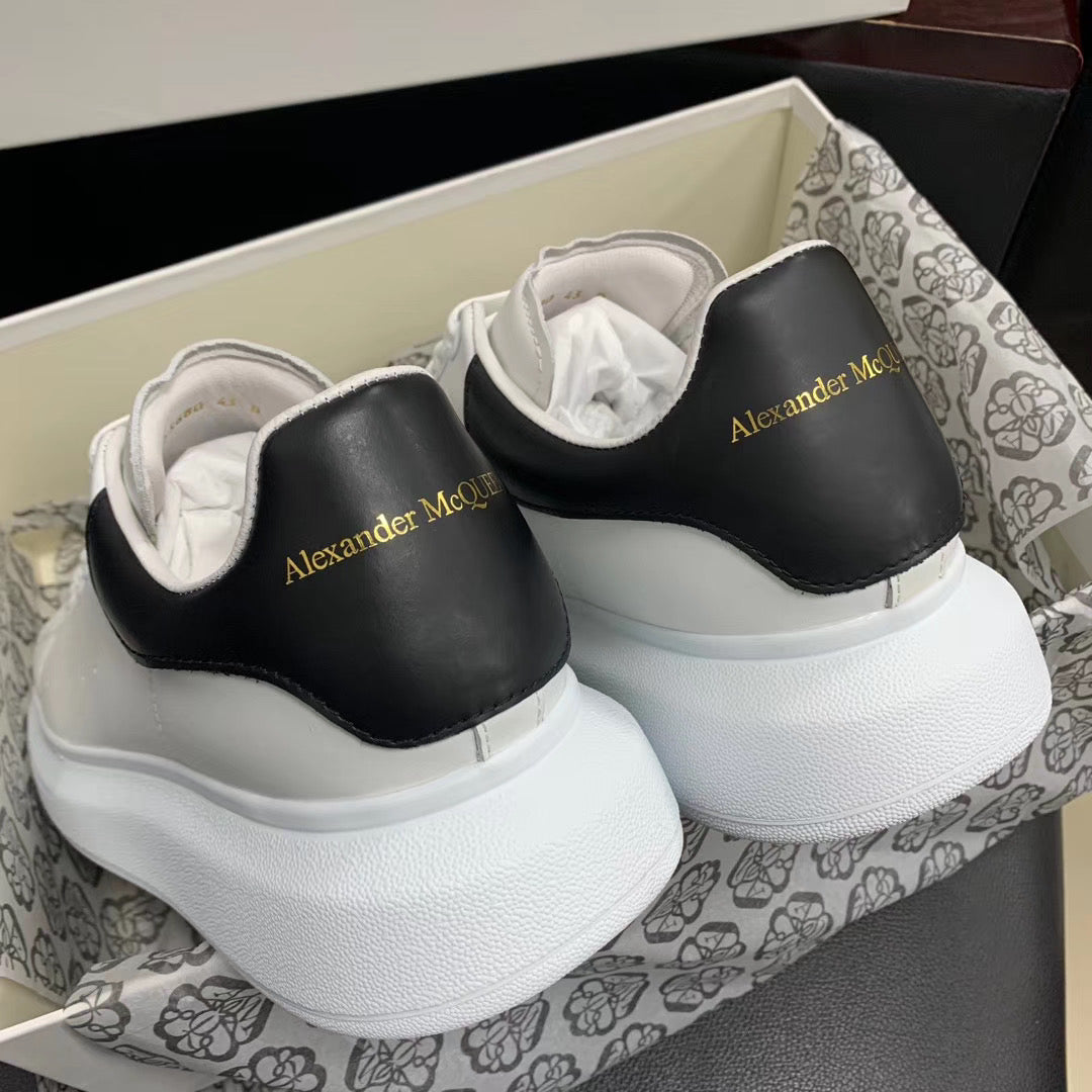 Oversized Black Leather Tab Sneakers