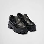 Brushed leather Monolith loafers – upper with leather band and metal triangle logo Apron with stitched raised edge – LUX VERSE Luxury Designer Fashion Outlet