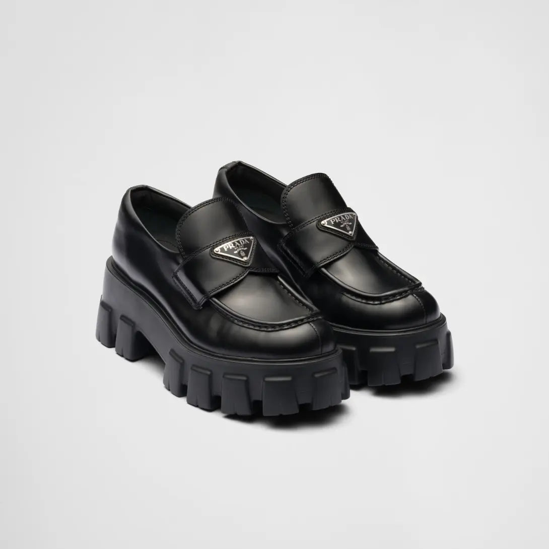 Brushed leather Monolith loafers – upper with leather band and metal triangle logo Apron with stitched raised edge – LUX VERSE Luxury Designer Fashion Outlet