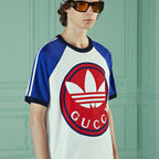 cotton jersey T-shirt – this cotton jersey T-shirt has contrast color details and the Trefoil print on – LUX VERSE Luxury Designer Fashion Outlet