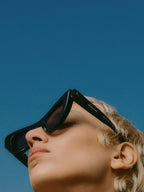 Black bold cat eye sunglasses – hinges and legal information appear on the exterior of each temple – LUX VERSE Luxury Designer Fashion Outlet