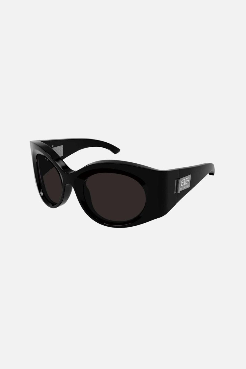 Black oval bold sunglasses – wrapping oval frames with fronts coming forward and outward, beyond curving lenses – LUX VERSE Luxury Designer Fashion Outlet