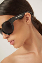 Black wrap around sunglasses – high relief metallic logo is prominently stamped on the middle of – LUX VERSE Luxury Designer Fashion Outlet