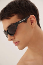 Xpander BB0202s-001 wrap around black sunglasses – lenses are set atop curved, bio injected frames, as opposed to inside or behind them – LUX VERSE Luxury Designer Fashion Outlet