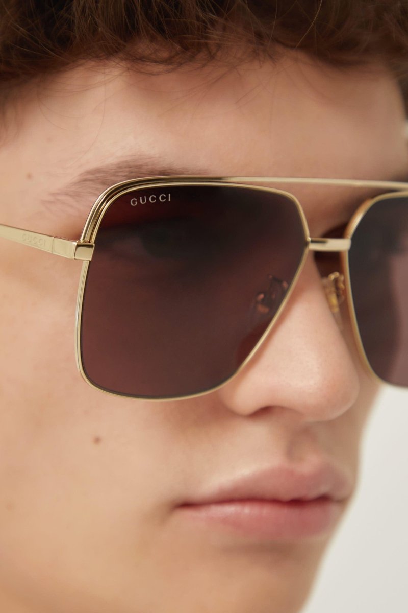 Gold metal squared sunglasses – to get you a better look at his seductive glance he slides his glasses down his nose – LUX VERSE Luxury Designer Fashion Outlet