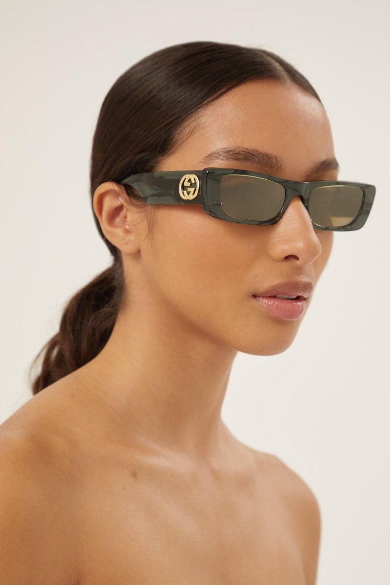 Green rectangular sunglasses – the temple tips end with a perforeted end tip – LUX VERSE Luxury Designer Fashion Outlet