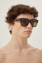 Havana squared sunglasses – there’s a golden light; Marcello, an aspiring novelist is taking a stroll and out – LUX VERSE Luxury Designer Fashion Outlet