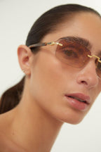 Micro metal sunglasses with logo all over – the integrated logo is framed by a series of details and becomes part of – LUX VERSE Luxury Designer Fashion Outlet