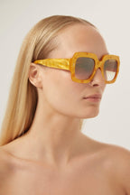 Oversized squared sustainable yellow sunglasses – the frames contain up to 68% bio-based acetate and are enriched with mineral glass – LUX VERSE Luxury Designer Fashion Outlet