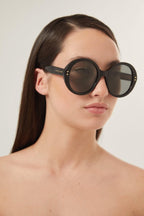 Round style black sunglasses – there’s a golden light; Marcello, an aspiring novelist is taking a stroll and out – LUX VERSE Luxury Designer Fashion Outlet