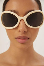 Wrap around ivory sunglasses – iconic rivets and lettering logo on the inner temple – LUX VERSE Luxury Designer Fashion Outlet