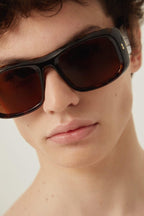 Wrap around rectangular style sunglasses – this wrap around rectangular style is characterized by a bold volume and texture, – LUX VERSE Luxury Designer Fashion Outlet