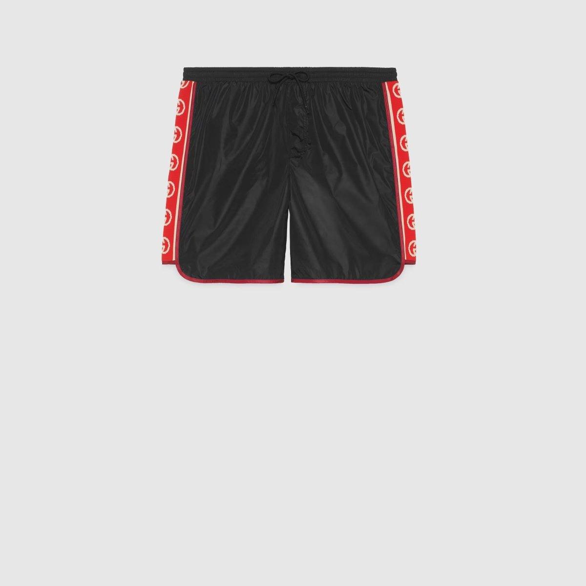 Nylon swim shorts with logo stripe – a new take on the logo tapes running down the sides of vintage tracksuits, the – LUX VERSE Luxury Designer Fashion Outlet
