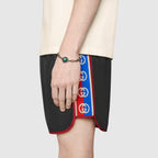 Nylon swim shorts with logo stripe – a new take on the logo tapes running down the sides of vintage tracksuits, the – LUX VERSE Luxury Designer Fashion Outlet