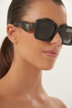 Squared sunglasses featuring the signature logo triangle – of silhouettes and colors: from the refined CinŽma styles to square – LUX VERSE Luxury Designer Fashion Outlet