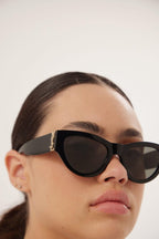 Black almond shape featuring bold YSL logo – a STRONG FEMININE CAT-EYE SHAPE, THE EVOLUTION OF THE MONOGRAM ACETATE IN A BOLDER – LUX VERSE Luxury Designer Fashion Outlet